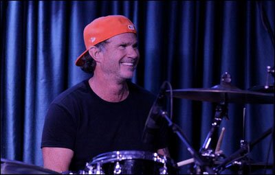 Hi, I'm a rock star wearing a baseball cap